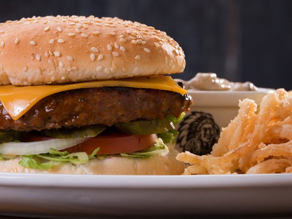 Cheddamelt Burger with chips served at Spur