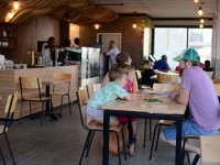 family dining inside at Surf Riders