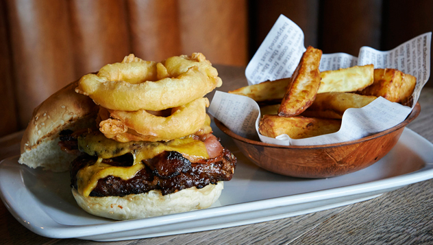 A burger with potato wedges. Photo courtesy of the restaurant.
