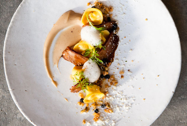 Smoked duck with chestnut puree, fontina tortellini, savoury granola, dried blueberries and parmesan. Photo by Jan Ras. 