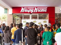 Fans wait in line at the entrance. Photo by Rupesh Kassen.