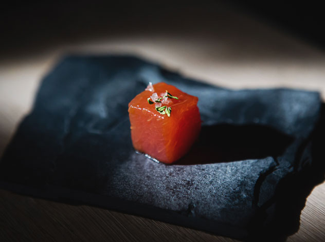 A cube of compressed watermelon is served as an amuse bouche before the drinks. Photo courtesy of the bar.