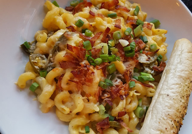 Three-cheese mac ’n cheese with jalapeños and crispy bacon.
