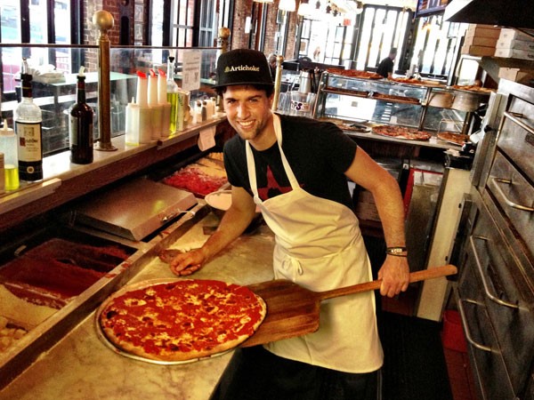 Marcus perfecting his pizza skills in New York. Photo supplied.