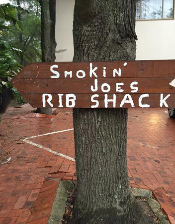 Sign on tree at Smokin Joe's Rib Shack