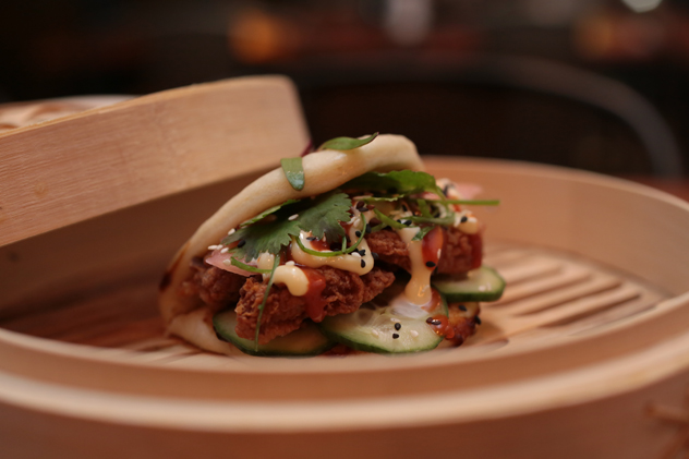 The Colonel Bao filled with crispy fried chicken and sriracha. Photo supplied.