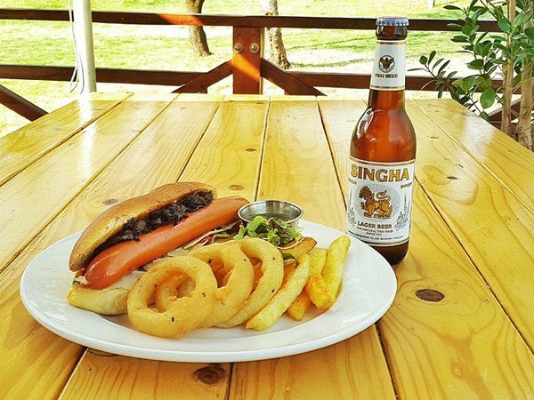 A hot dog with onion rings at Capital Craft. Photo supplied.