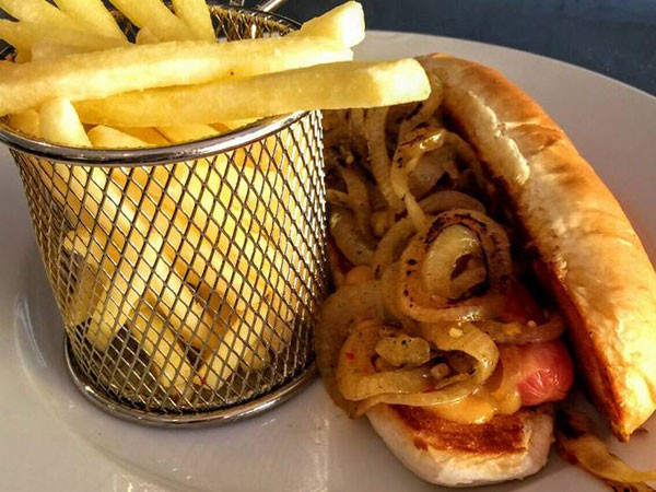 An onion-topped hot dog at Three Monkeys in Glenwood. Photo supplied.