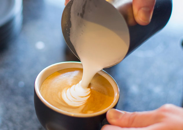 A flat white being poured at Vintage Coffee. Photo supplied.