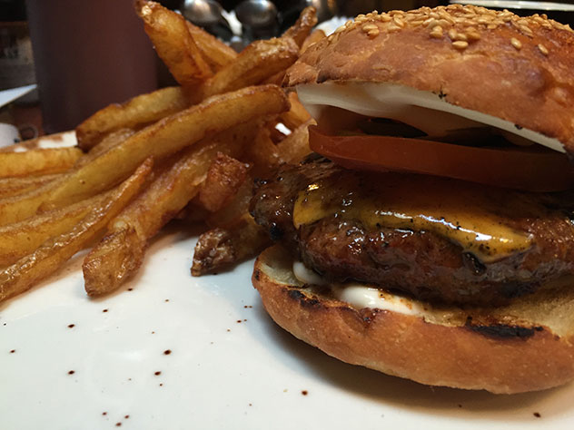 The burger gets the thumbs up, and the chips are perfection. Photo by Amy Ebedes.