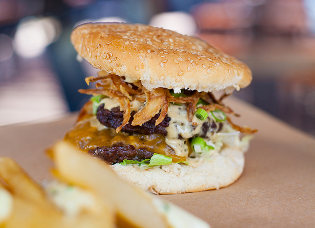 The Bus Pass burger with two smashed patties, crispy onion rings and pepper sauce. Photo supplied.
