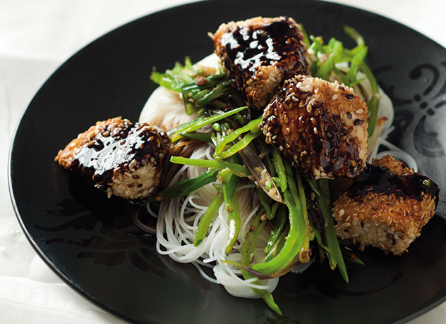 Serve sesame chicken over delicate rice noodles. Photo supplied.