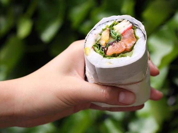 A glorious salmon-filled sushirrito at Surf Riders. Photo supplied.