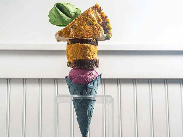 This dessert parlour is putting pie and slices of cake on top of ice cream