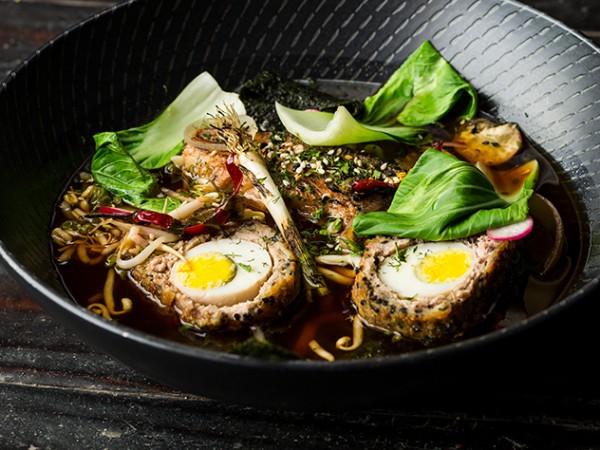 Rock 'n Ramen pork belly ramen with a soft boiled scotch egg, udon noodles, spring onion, toasted sesame, Chinese leaf, and bean sprouts in a lemongrass broth. Photo by Michael le Grange.