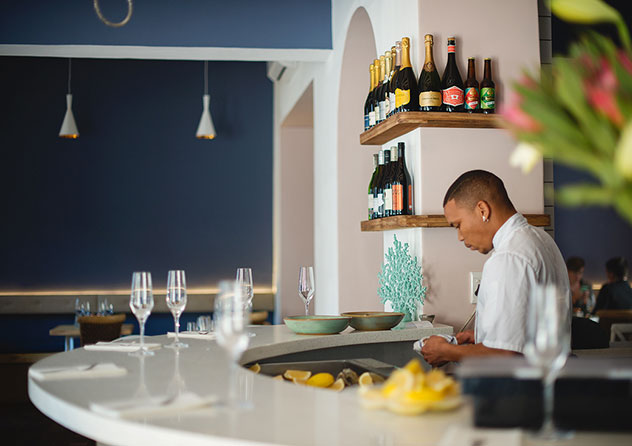 The bar is well-stocked with bubblies and fish-friendly whites. Photo by Claire Gunn.
