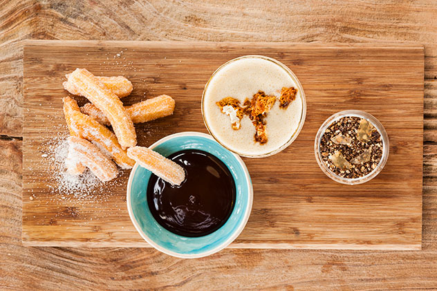 Churros with tonka and melted chocolate popcorn shake and miso-and-orange cheesecake with pretzel crumb. Photo supplied.