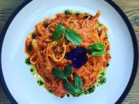 Tomato pasta with green herbs