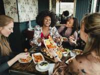 women in restaurant eating