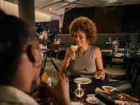 FRIENDS EATING DINNER